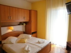 Postel nebo postele na pokoji v ubytování Guest House Palme