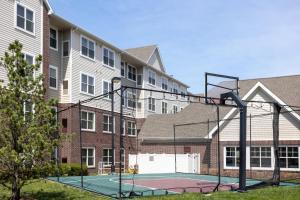 a basketball court in front of a apartment complex at Residence Inn Largo Medical Center Drive in Largo