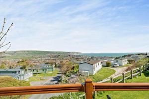 a view of a town from the balcony of a house at Butterfly Lodge in Swanage
