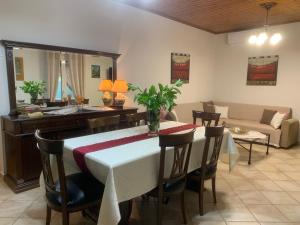 a living room with a table and a couch at Diamanto's Home in Kastanéa
