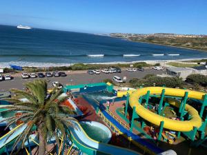 a water park with a water slide on the beach at Spacious 2 bedroom space with breathtaking seaview in Mossel Bay