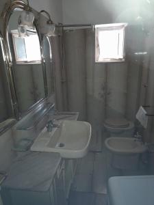 Ванна кімната в Appartamenti mastromatteo