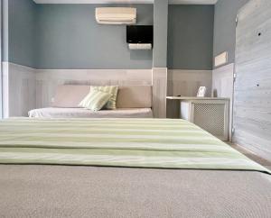 Postel nebo postele na pokoji v ubytování Hostal Noli