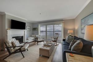 a living room with a couch and a fireplace at 214 Water Street Inn in Boyne City