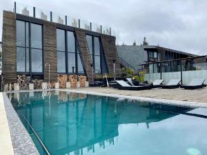 a swimming pool in front of a house at Taka Matanzas in Matanzas