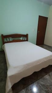 Ein Bett oder Betten in einem Zimmer der Unterkunft Casa 29 casa inteira