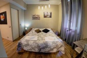 a bedroom with a bed with two pillows on it at La maison di Roberto in La Spezia