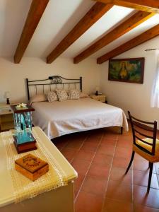 a bedroom with a bed and a table in a room at Casa Vacanze Nonno Aldo in Minori