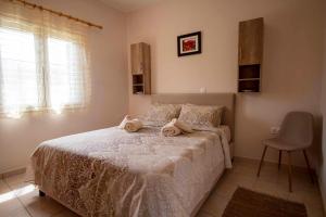 A bed or beds in a room at Casa Greca Vacation Home Acharavi Corfu Még 13 kép