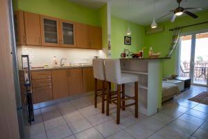 A kitchen or kitchenette at Casa Greca Vacation Home Acharavi Corfu