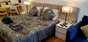 Ein Bett oder Betten in einem Zimmer der Unterkunft Cantinho do Auka - Studio