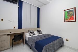 Postel nebo postele na pokoji v ubytování Hotel Emberá