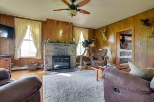 a living room with a couch and a fireplace at Rustic Wellsville Home - 5 Mi to Roundtop Mountain 