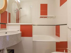 a bathroom with a sink and a toilet at Appartement Les Arcs 1800, 2 pièces, 5 personnes - FR-1-346-380 in Arc 1800