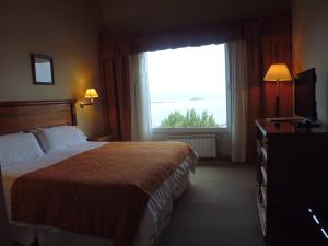 Cama ou camas em um quarto em Terrazas Del Calafate