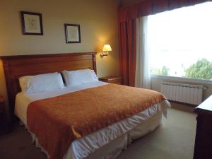 Cama ou camas em um quarto em Terrazas Del Calafate