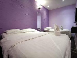 Postel nebo postele na pokoji v ubytování Juru Hotel