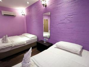 Postel nebo postele na pokoji v ubytování Juru Hotel