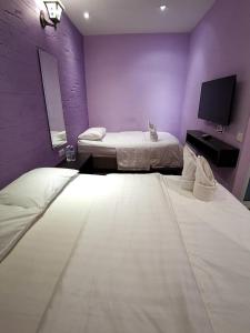 Postel nebo postele na pokoji v ubytování Juru Hotel