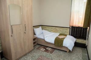Ένα ή περισσότερα κρεβάτια σε δωμάτιο στο ASA Hotel
