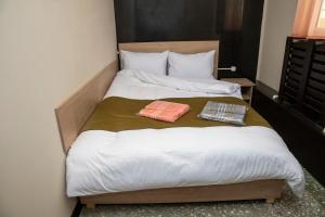 Ένα ή περισσότερα κρεβάτια σε δωμάτιο στο ASA Hotel