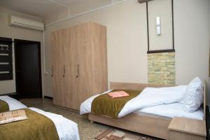 Ένα ή περισσότερα κρεβάτια σε δωμάτιο στο ASA Hotel