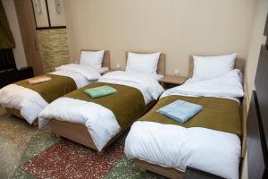Ένα ή περισσότερα κρεβάτια σε δωμάτιο στο ASA Hotel