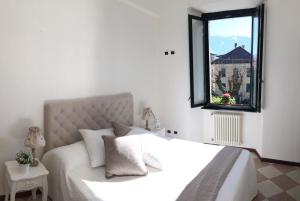 A bed or beds in a room at Hotel Villa San Fedele