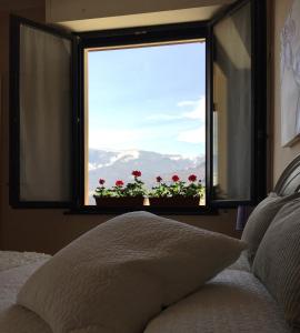 A bed or beds in a room at Hotel Villa San Fedele
