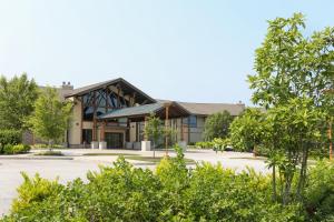 a building with a lot of trees in front of it at Liberty Mountain Resort in Fairfield