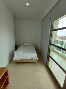 Postel nebo postele na pokoji v ubytování Hotel Palermo Sincelejo