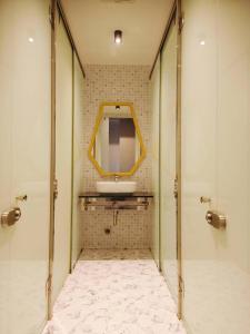 a bathroom with a sink and a mirror at Icon Hotel Hatyai in Hat Yai +125 photos