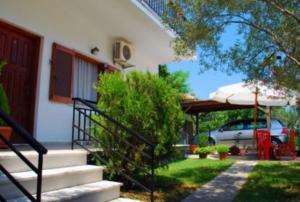 a set of stairs leading to a house at Villa Fotini in Prinos