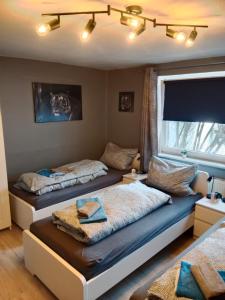 En eller flere senge i et værelse på Flensburg Mitte 38