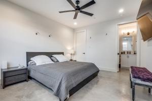 a bedroom with a bed and a ceiling fan at Close to Uptown / Downtown in Dallas