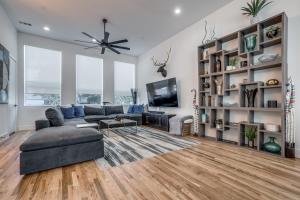 a living room with a couch and a tv at Close to Uptown / Downtown in Dallas