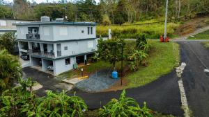 an aerial view of a house with a yard at Green Studio 1 - just 7 min drive to the beach in Rincon