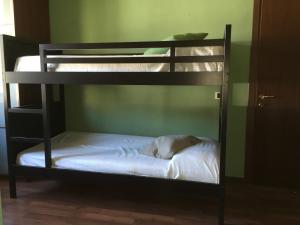 A bed or beds in a room at Hotel Villa San Fedele