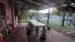 a patio with a table and chairs in a house at Casa Funes in Funes