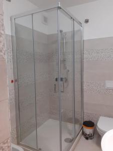 a shower stall in a bathroom with a toilet at La Casa di Romeo in Ateleta