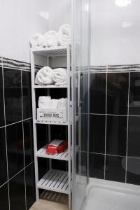 a towel rack in a bathroom with a shower at EDEN RENTALS Rincón Cozy in Taco