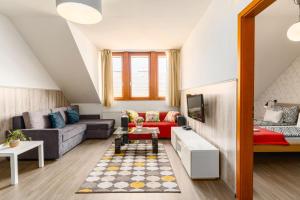 a living room with a couch and a tv at Lovag charming apartment in the center-AC in Budapest