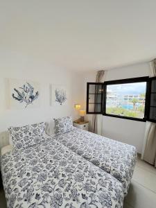 Postel nebo postele na pokoji v ubytování Casahost Bastian Boutique II Seaview