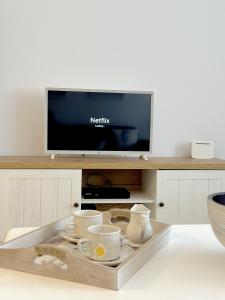 Telewizja i/lub zestaw kina domowego w obiekcie Casahost Bastian Boutique II Seaview