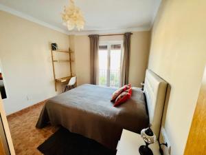 Łóżko lub łóżka w pokoju w obiekcie Casa con increíbles vistas a las montañas y al mar
