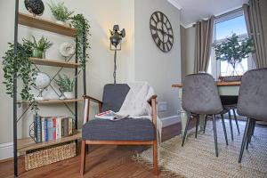 a living room with a table and chairs and a table and a dining room at Host & Stay - Newington Road in Northampton