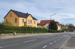 a street with houses on the side of a road at Ferienwohnung Schulz in Dresden