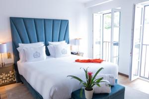 Cama ou camas em um quarto em Hotel República Boutique Hotel