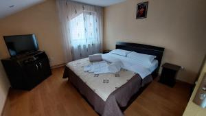 Postel nebo postele na pokoji v ubytování Vila Coman