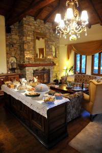 a kitchen with a table with food on it at Archontiko Polyzos in Portaria